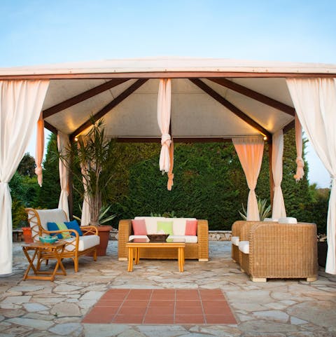 Sip a sundowner in lavish outdoor lounges across the grounds