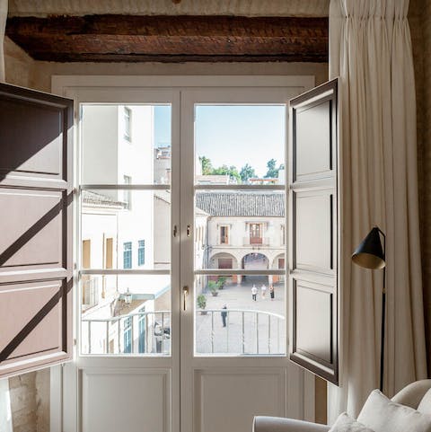 Enjoy courtyard views from the bedroom