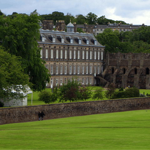 Admire the Queen’s official Scottish residence, the Palace of Holyroodhouse, a ten-minute stroll away