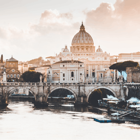 Walk along the River Tiber for twenty-five minutes to St Peter's Basilica in Vatican City