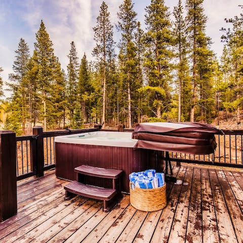 Soak in the bubbling hot tub amidst the pines