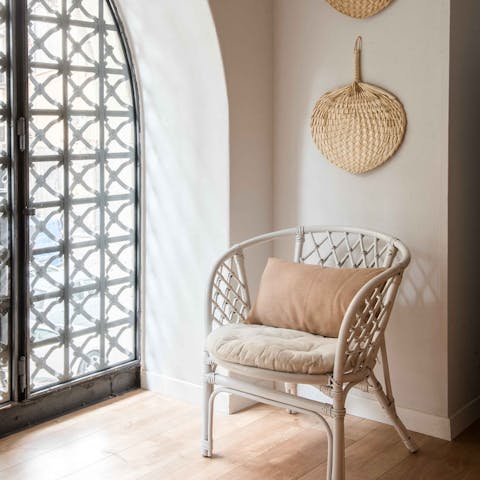 Take a seat by the wrought-iron windows and relax with a book