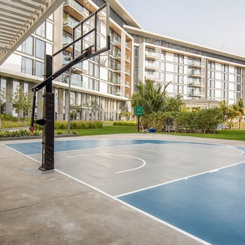 Keep fit on this communal basketball court or head to the gym for a workout session