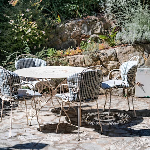 Enjoy a glass of Champagne at your alfresco dining table