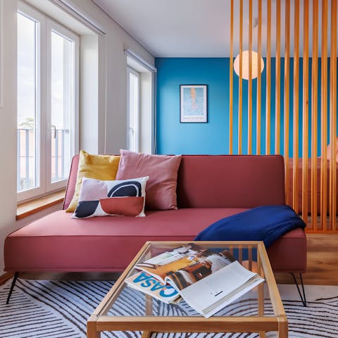 Relax in the bright living area with a glass of Portuguese wine after a day of exploring