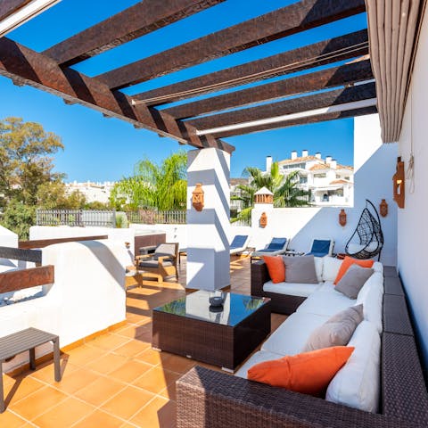 Gather on the terrace for dinner and drinks, admiring the views of Nueva Andalucia and the mountains