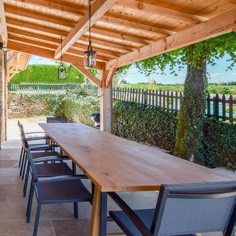 Gather at the outdoor dining table to enjoy a home-cooked French feast