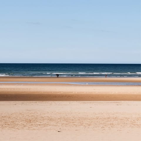 Plan a day trip to Normandy Beach, about an hour away by car