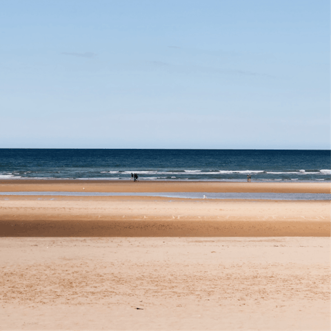 Plan a day trip to Normandy Beach, about an hour away by car