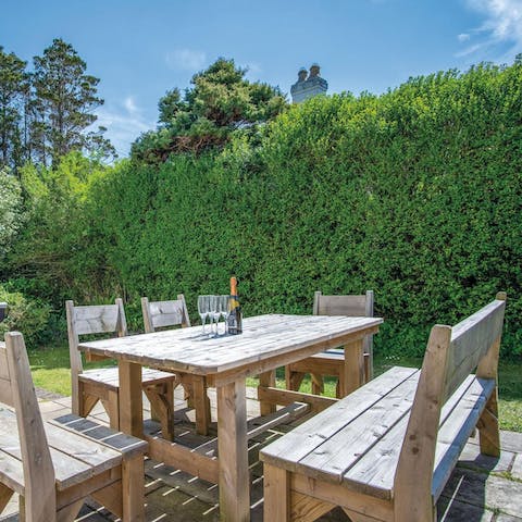 Light the barbecue and enjoy alfresco meals in the tranquil garden