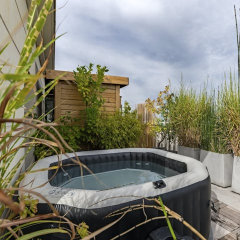 Relax with a glass of Champagne in the hot tub