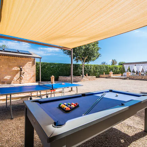 Challenge your friends to a game of pool or ping pong in the shade