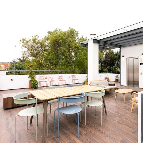 Relax with a drink on the roof deck