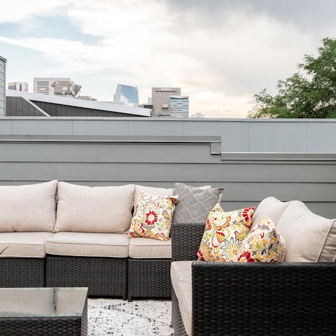 Bookmark the day with a couple of drinks on your rooftop deck