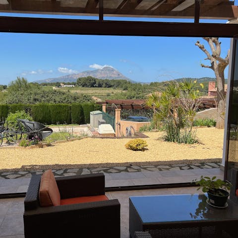 Gaze out at the dramatic mountainscape from the shaded terrace