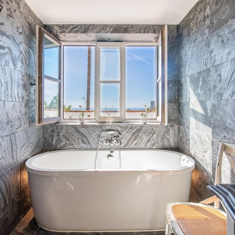 Relax with a luxurious bubble bath after a busy day at the beach