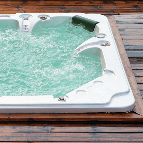 Hop in the hot tub for an evening soak under the stars