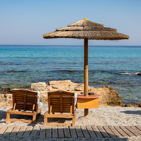 Take the short drive down to Paralia Elli, where you'll find crystal clear waters and beach clubs