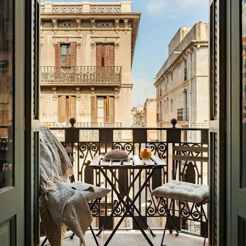 Enjoy a cafe con leche on the elegant balcony