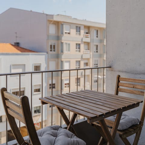 Relax on the balcony with a bottle of red wine