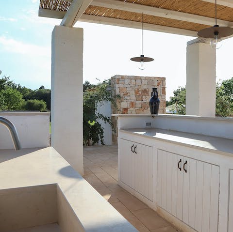 Cook up some local Italian fare at the outdoor kitchen area 