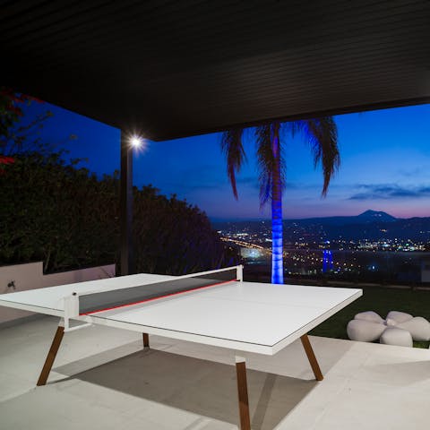 Get a game of ping pong going at the table with a view