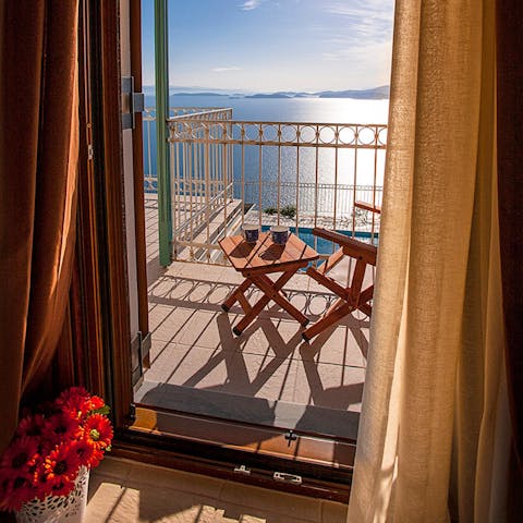 Wake up and pad straight out onto the balcony to enjoy your morning cup of coffee in the fresh sea air