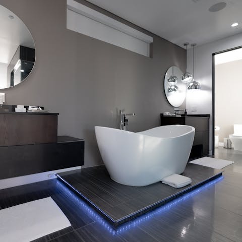 Soak in the elegant in-suite bathtub