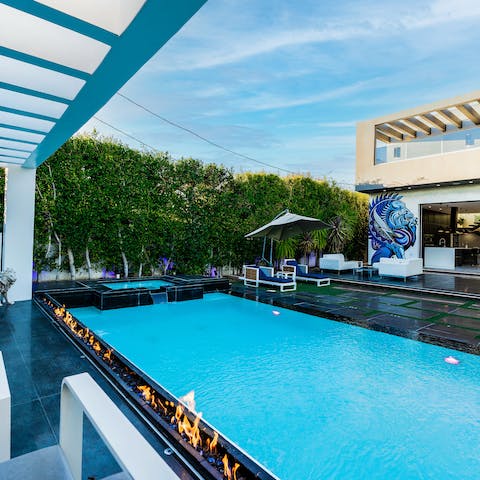 Spend sunny days laid out by the pool and evenings by the fire pit