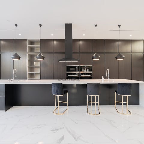 Sit down to spectacular feasts in the sleek kitchen