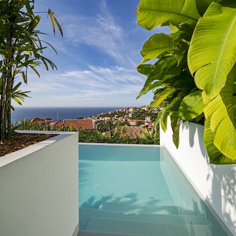 Climb down the steps into your stunning infinity pool