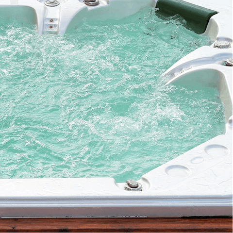 Treat yourself to a soak in the unique private hot tub