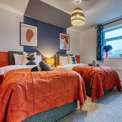 Get a great night's sleep in the colourful twin bedrooms