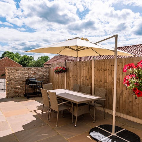 Get the barbecue going and dine alfresco on the shaded patio area 