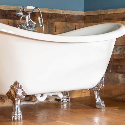 Soak in the glorious claw-footed tub in the master bedroom