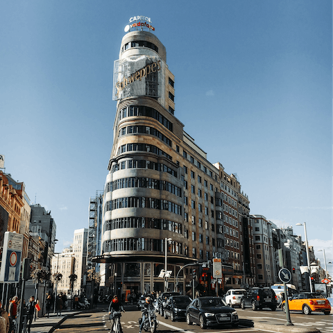 Stay steps away from the Gran Vía shopping and theatre district 