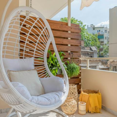 Hang out in the egg chair on the private balcony