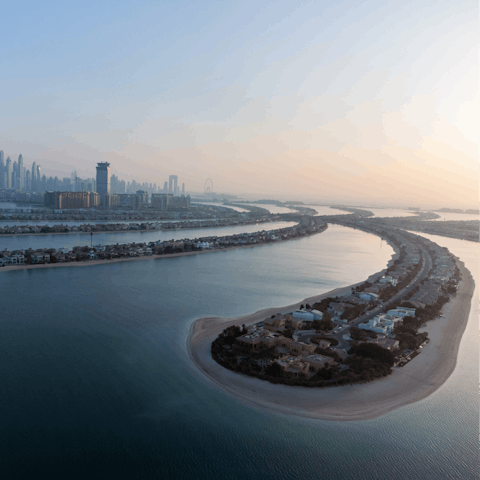 Take a trip around the Palm Jumeirah on a private speedboat at sunset