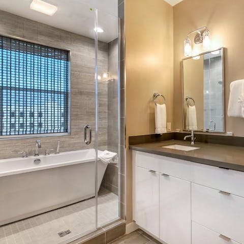 Slope away for a soak in the freestanding bathtub
