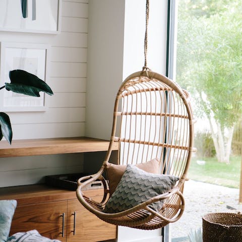Curl up with a good book in the hanging rattan chair