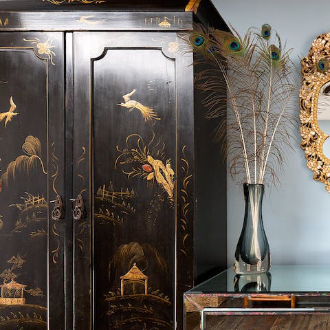 Admire the artsy collection of antique furniture and curios