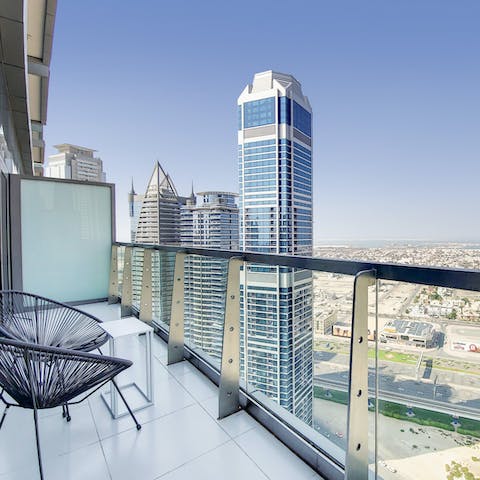Soak up the Business Bay district from your private balcony