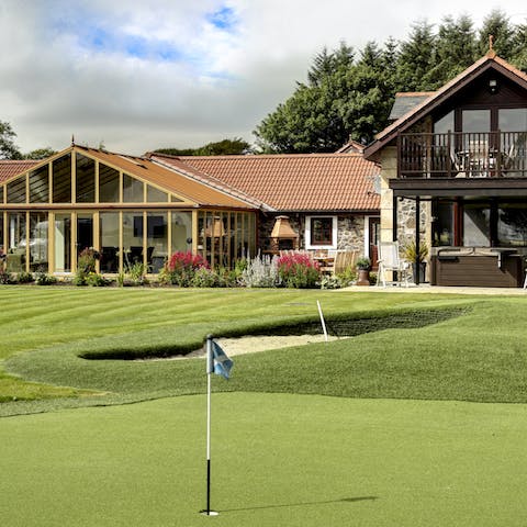Practise your swing on the private driving range before hitting the famous Old Course