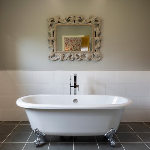 Fill the claw-foot tub with bubbles for a luxurious bath