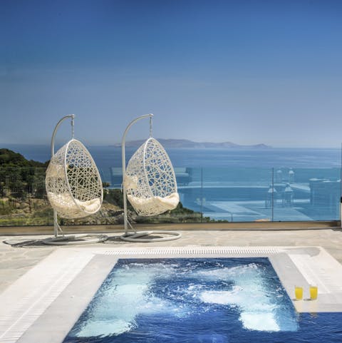 Spend relaxing mornings admiring the sea views from the swinging egg chairs