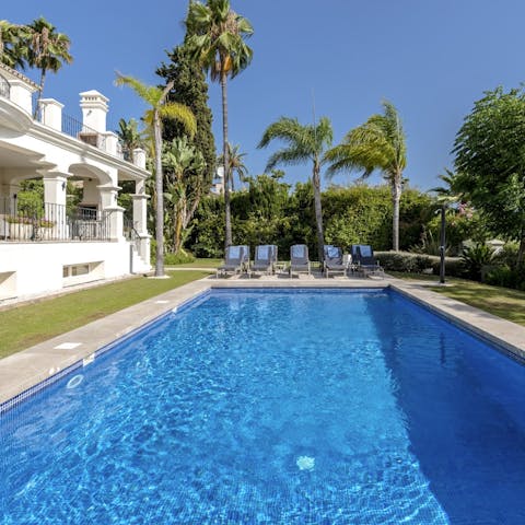 Relax by the pool and take a swim in its glistening waters 