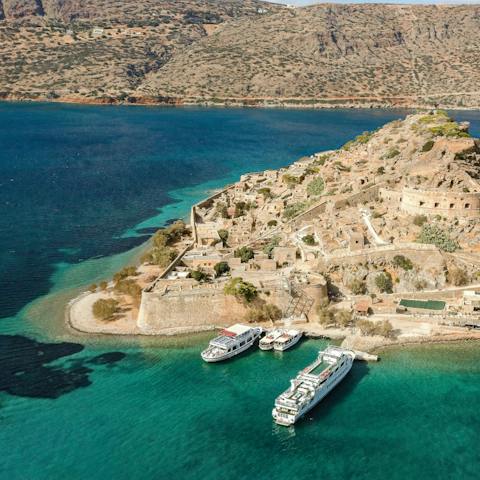 Catch the boat over to the fascinating Spinalonga island from Elounda, a thirty-five-minute drive