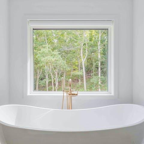 Run a bath and soak all your worries away with a view of the trees