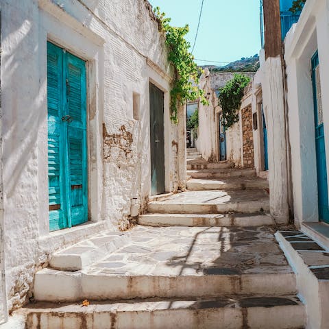 Drive seven minutes to Naxos Town for restaurants, shops and bars