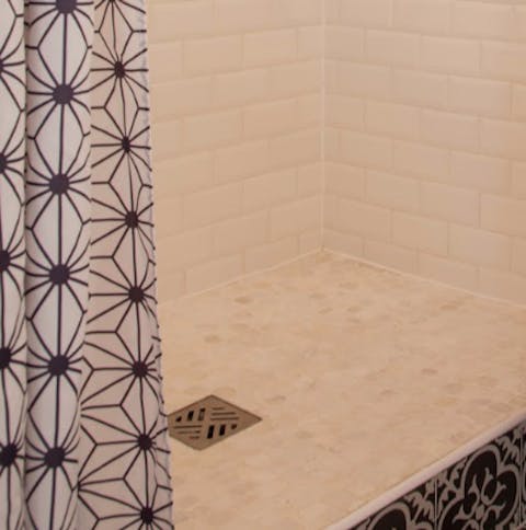 Contemporary geometric tiles in the shower rooms